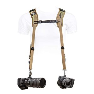 The OP/TECH USA Dual Harness is a unique 3-point slinger that allows you to carry two cameras simultaneously, making it ideal for professional photographers or videographers who frequently switch between cameras. It features a cross-body design with adjustable straps that distribute the weight of the cameras evenly across your shoulders and back, reducing strain on your neck and shoulders. The Dual Harness also includes quick-release buckles that make it easy to detach one or both cameras when needed.