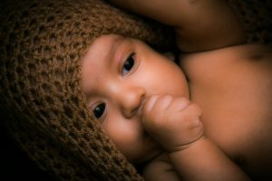 Close-up of newborn's tiny toes and gentle fingers