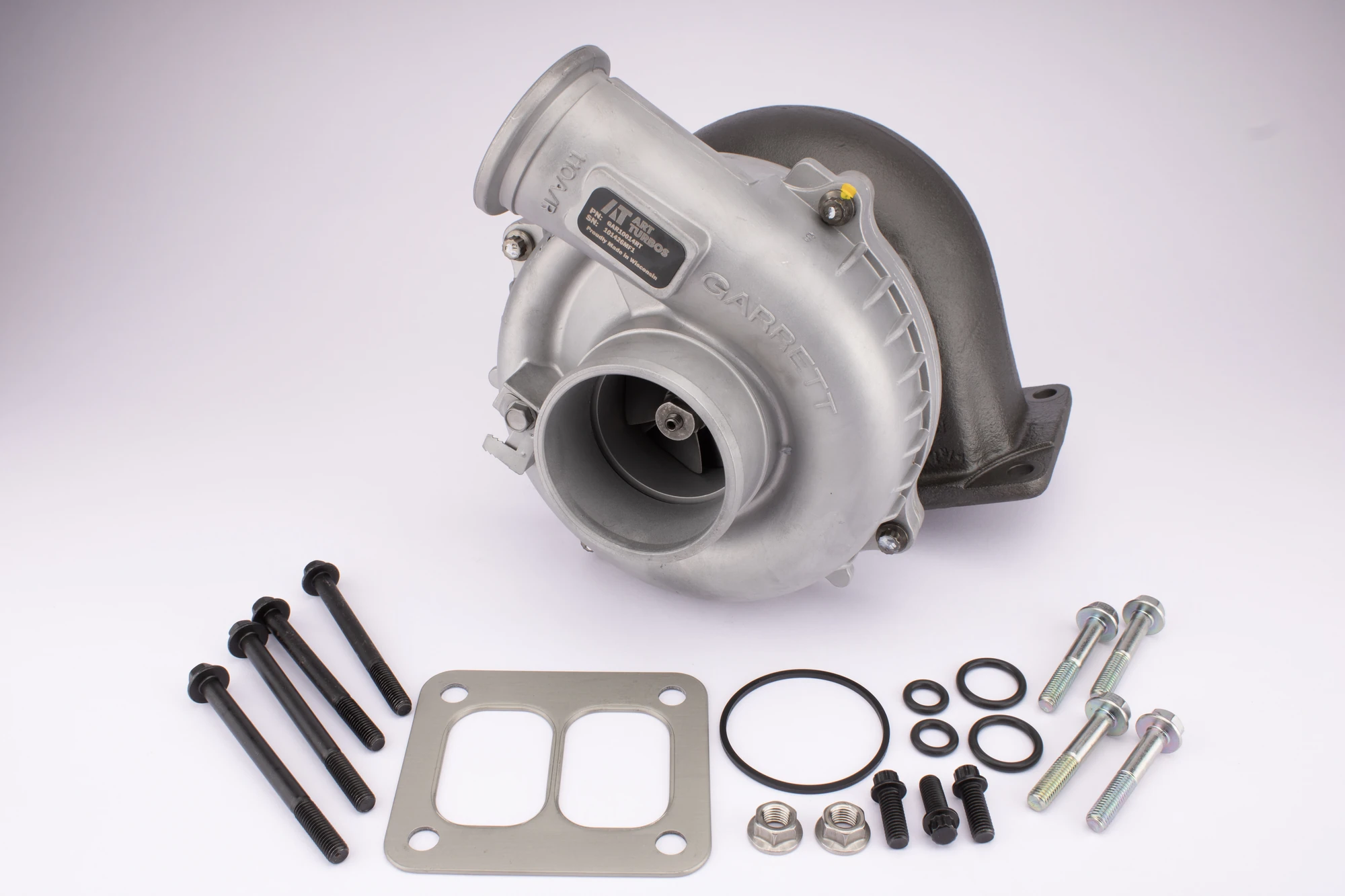 Turbocharger and fitting kit before car parts photo editing on a studio background